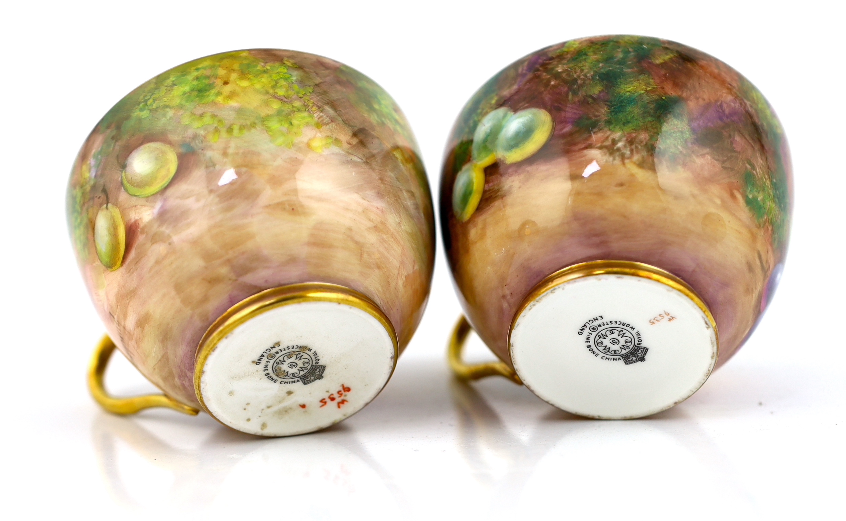 A pair of Royal Worcester fruit painted tea cups and saucers, 1960s